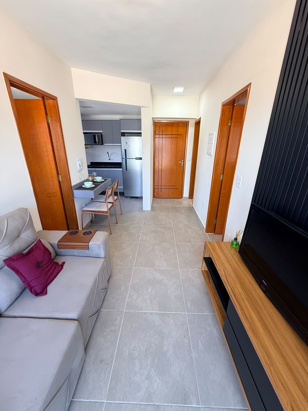 Living integrado com painel de TV